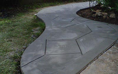 Custom sidewalk, hand-cut joints.